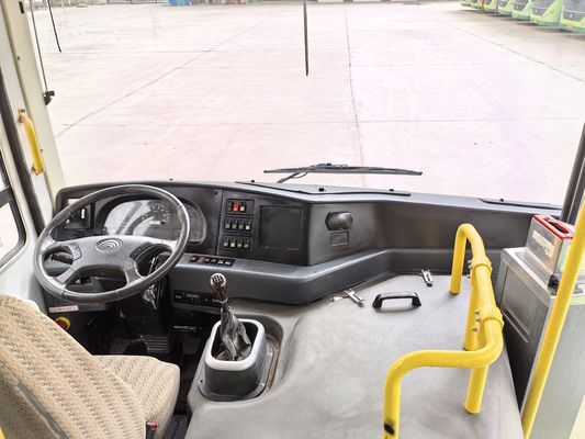 A second-hand 8-meter left-hand drive green diesel bus