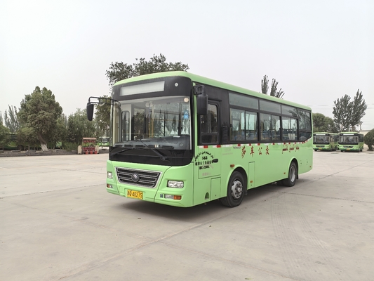 A second-hand 8-meter left-hand drive green diesel bus