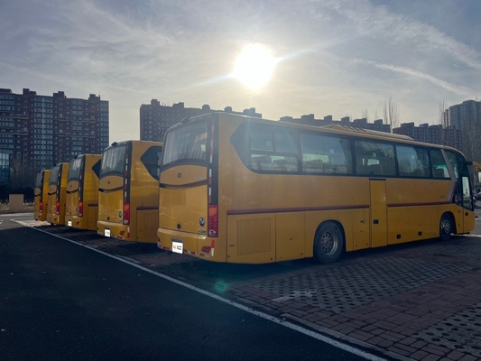 A second-hand yellow King Long bus with a 63-seat Yuchai engine and manual transmission