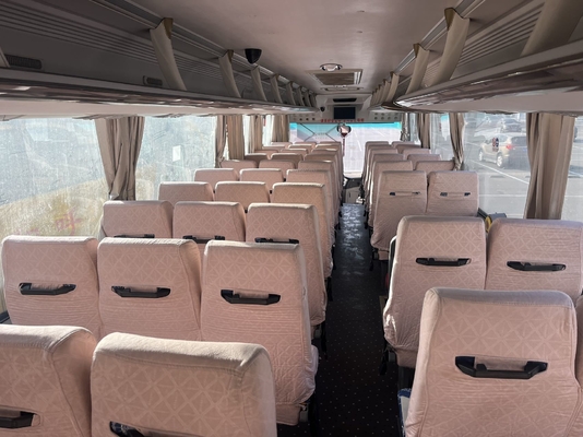 A second-hand yellow King Long bus with a 63-seat Yuchai engine and manual transmission